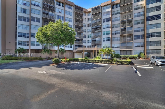 1000 Saint Charles Pl Unit 418, Pembroke Pines, FL 33026 - view of apartment building / complex featuring uncovered parking