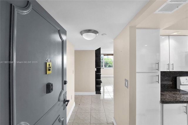 1000 Saint Charles Pl Unit 418, Pembroke Pines, FL 33026 - hallway with light tile patterned floors and baseboards