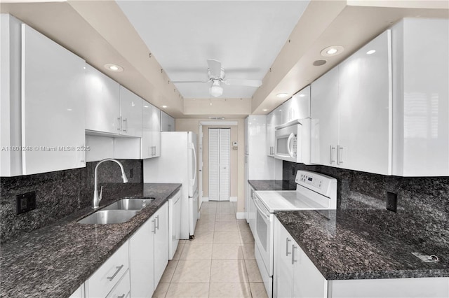1000 Saint Charles Pl Unit 418, Pembroke Pines, FL 33026 - kitchen featuring white appliances, a sink, white cabinets, decorative backsplash, and ceiling fan