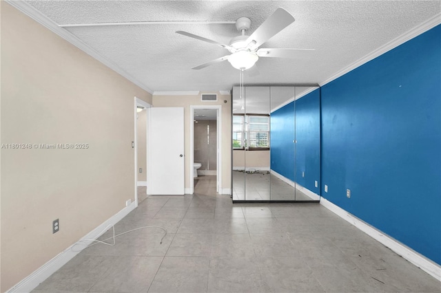 1000 Saint Charles Pl Unit 418, Pembroke Pines, FL 33026 - spare room featuring ceiling fan, a textured ceiling, crown molding, and baseboards