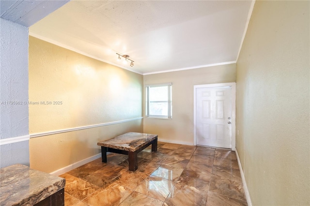 18000 NW 6th Pl, Miami Gardens, FL 33169 - corridor featuring crown molding, baseboards, track lighting, and a textured wall