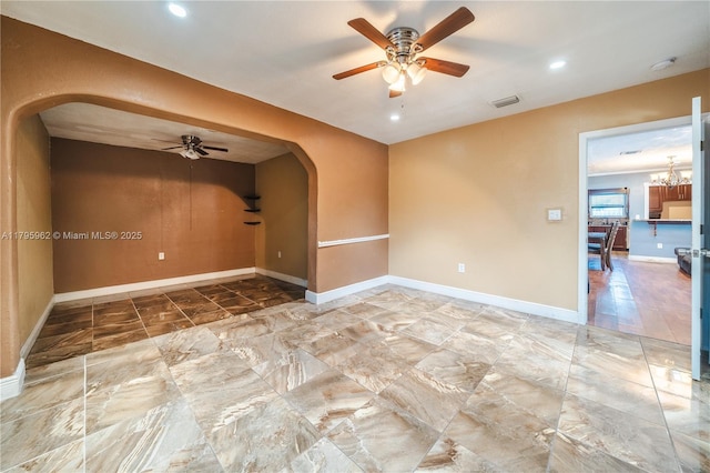 18000 NW 6th Pl, Miami Gardens, FL 33169 - empty room with arched walkways, ceiling fan, baseboards, and recessed lighting