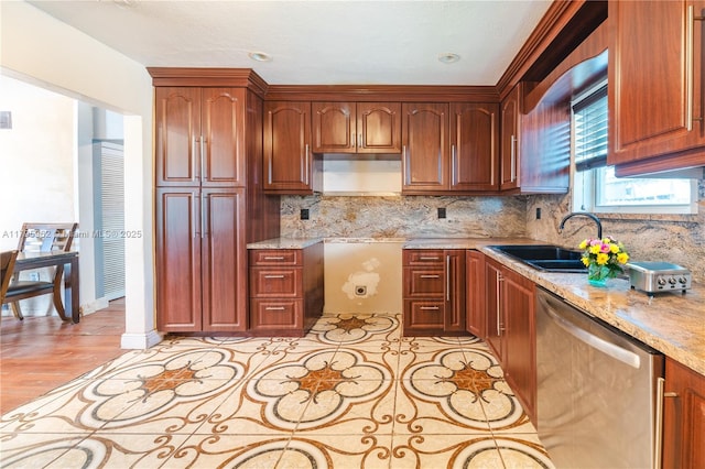 18000 NW 6th Pl, Miami Gardens, FL 33169 - kitchen with stainless steel dishwasher, backsplash, a sink, and light stone countertops