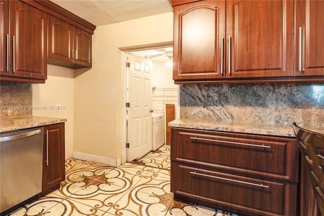 18000 NW 6th Pl, Miami Gardens, FL 33169 - kitchen with stainless steel dishwasher, tasteful backsplash, baseboards, washer / clothes dryer, and light stone counters
