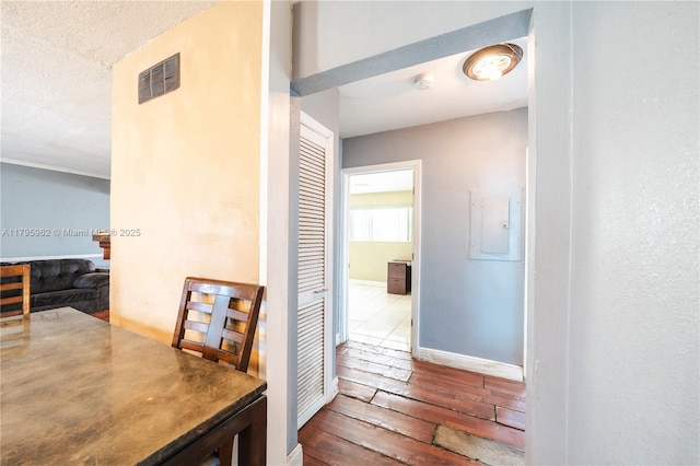 18000 NW 6th Pl, Miami Gardens, FL 33169 - hall featuring wood-type flooring, a textured ceiling, and electric panel
