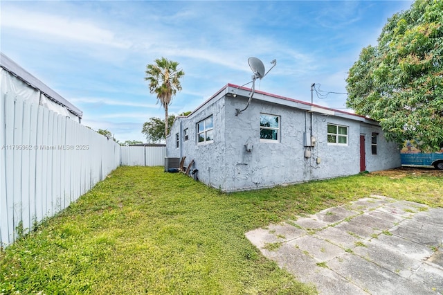 18000 NW 6th Pl, Miami Gardens, FL 33169 - rear view of house with stucco siding and central AC unit