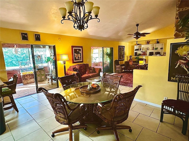 dining space with a chandelier, tile patterned floors, and ceiling fan