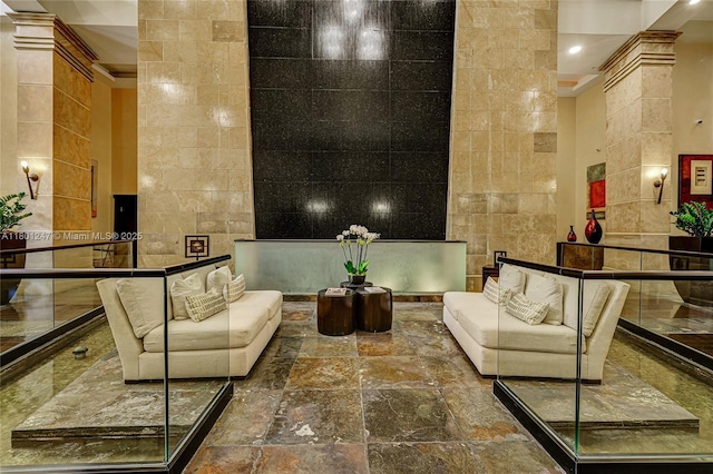 16275 Collins Ave Unit 2002, Sunny Isles Beach, FL 33160 - lobby with crown molding, a high ceiling, tile walls, and recessed lighting