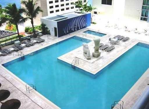 335 S Biscayne Bl Unit 902, Miami, FL 33131 - community pool featuring a community hot tub and a patio area