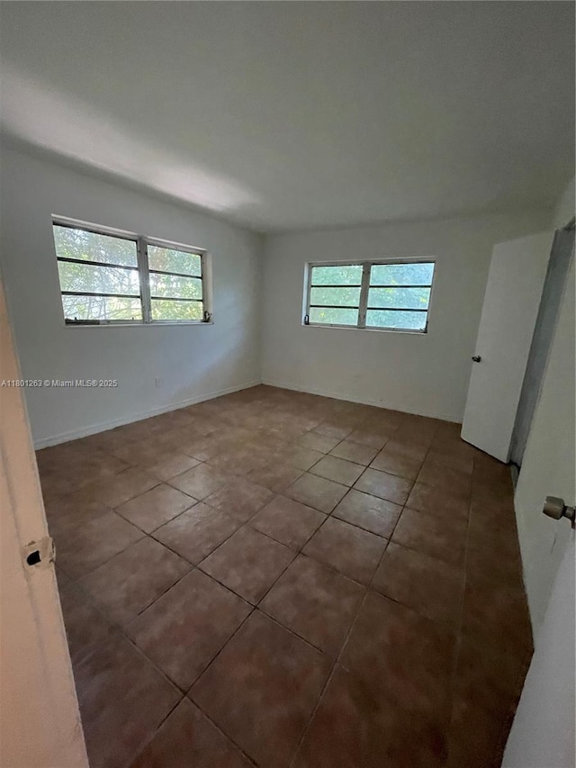7841 Dunham Blvd Unit 6, Miami, FL 33138 - tiled spare room with plenty of natural light