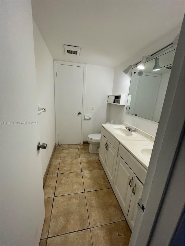 7841 Dunham Blvd Unit 6, Miami, FL 33138 - bathroom featuring double vanity, tile patterned flooring, and toilet