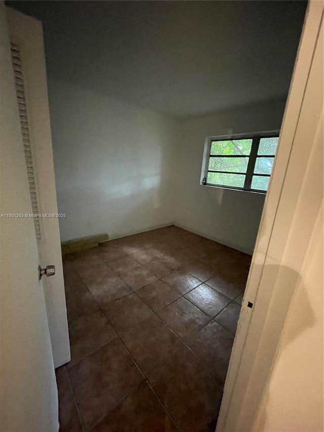 7841 Dunham Blvd Unit 6, Miami, FL 33138 - spare room featuring dark tile patterned floors