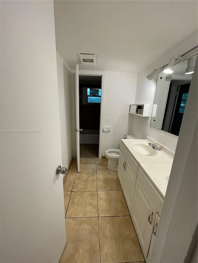 7841 Dunham Blvd Unit 6, Miami, FL 33138 - bathroom with tile patterned floors, toilet, and double vanity