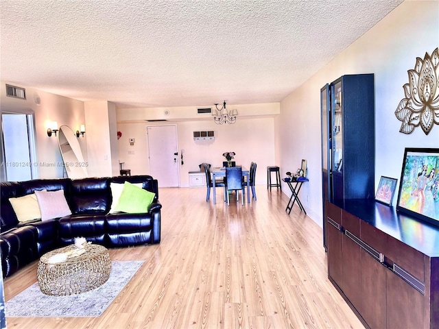 600 Three Islands Blvd Unit 905, Hallandale Beach, FL 33009 - living area with light wood finished floors and a textured ceiling