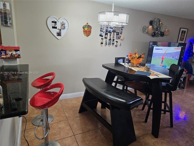 17472 SW 140th Ct, Miami, FL 33177 - dining area featuring tile patterned flooring and a textured ceiling