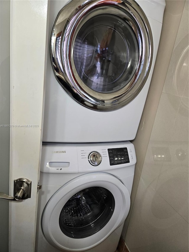 17472 SW 140th Ct, Miami, FL 33177 - laundry room featuring stacked washer / drying machine
