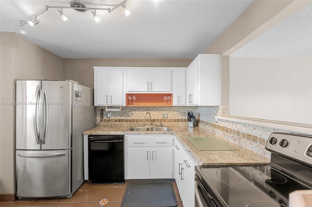 121 Golden Isles Dr Unit 905, Hallandale Beach, FL 33009 - kitchen featuring appliances with stainless steel finishes, a sink, white cabinetry, and light countertops