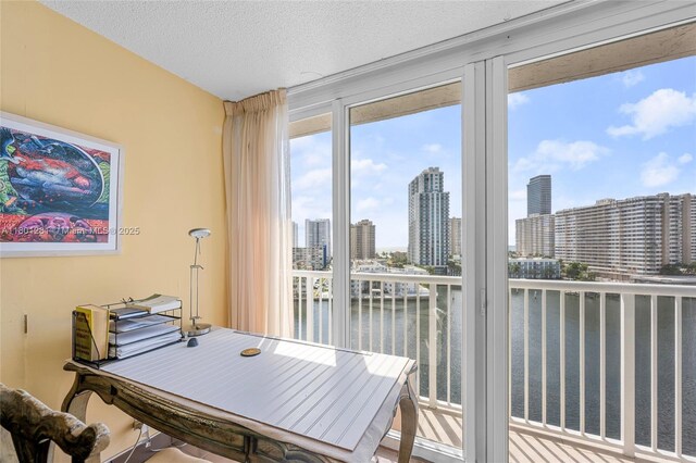 121 Golden Isles Dr Unit 905, Hallandale Beach, FL 33009 - sunroom with a water view and a skyline view