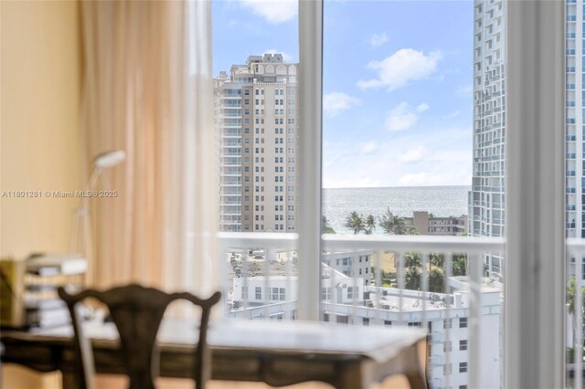 121 Golden Isles Dr Unit 905, Hallandale Beach, FL 33009 - sitting room with a water view, plenty of natural light, and a city view