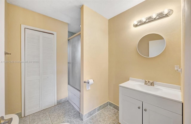 20707 SW 240th St, Homestead, FL 33031 - full bath with a closet, vanity, baseboards, and tile patterned flooring
