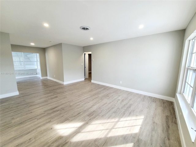 4230 NW 52nd Ave, Lauderdale Lakes, FL 33319 - spare room with light wood-type flooring, baseboards, and recessed lighting