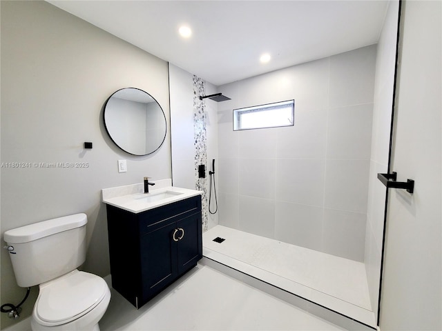 4230 NW 52nd Ave, Lauderdale Lakes, FL 33319 - bathroom with a tile shower, toilet, vanity, and recessed lighting