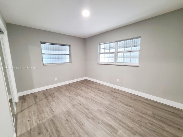 4230 NW 52nd Ave, Lauderdale Lakes, FL 33319 - empty room with wood finished floors and baseboards