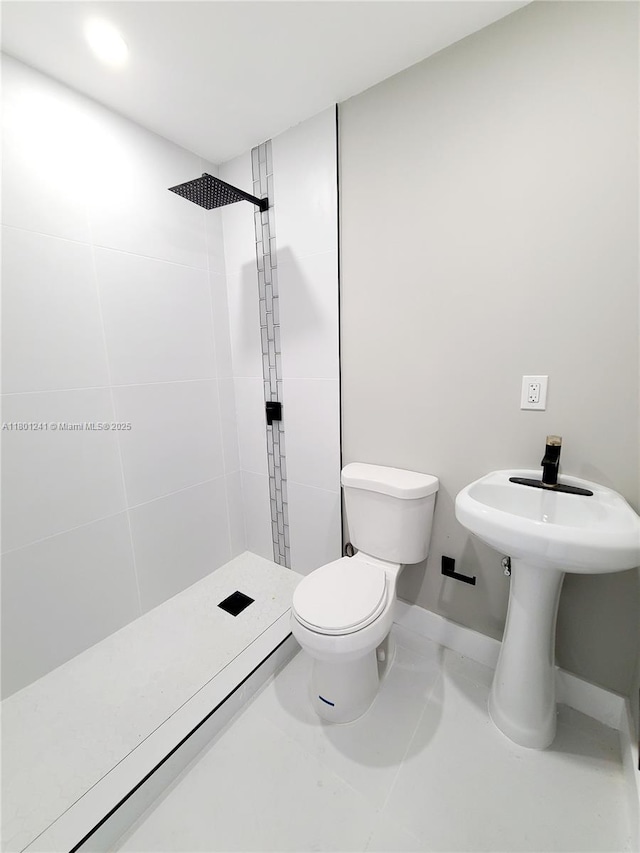 4230 NW 52nd Ave, Lauderdale Lakes, FL 33319 - full bath featuring a stall shower, toilet, baseboards, and tile patterned floors