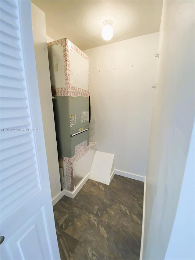 laundry room featuring baseboards