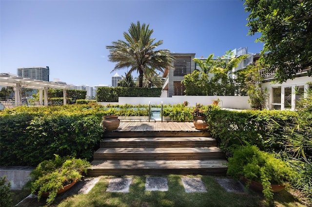 5215 Pine Tree Dr, Miami Beach, FL 33140 - view of yard with a wooden deck and fence