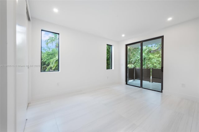 3637 SW 3rd Ave Right, Unit Right, Miami, FL 33145 - empty room with healthy amount of natural light, recessed lighting, and light tile patterned floors