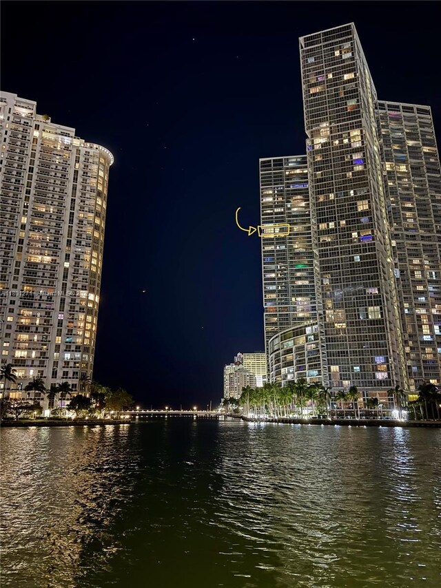 495 Brickell Ave Unit 4102, Miami, FL 33131 - property at twilight with a water view and a view of city lights