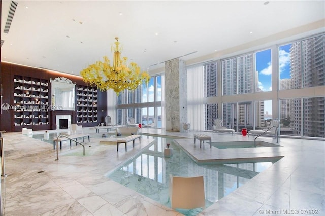 495 Brickell Ave Unit 4102, Miami, FL 33131 - view of pool with a chandelier, a view of city, and a fireplace