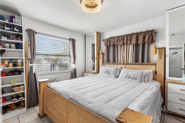 621 E 8th St, Hialeah, FL 33010 - bedroom with light tile patterned flooring