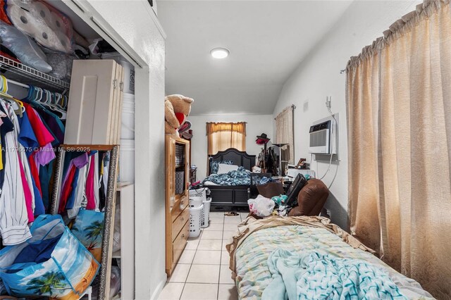 621 E 8th St, Hialeah, FL 33010 - tiled bedroom featuring an AC wall unit and lofted ceiling