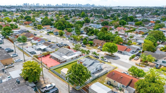621 E 8th St, Hialeah, FL 33010 - aerial view of residential area with property parcel outlined and skyline