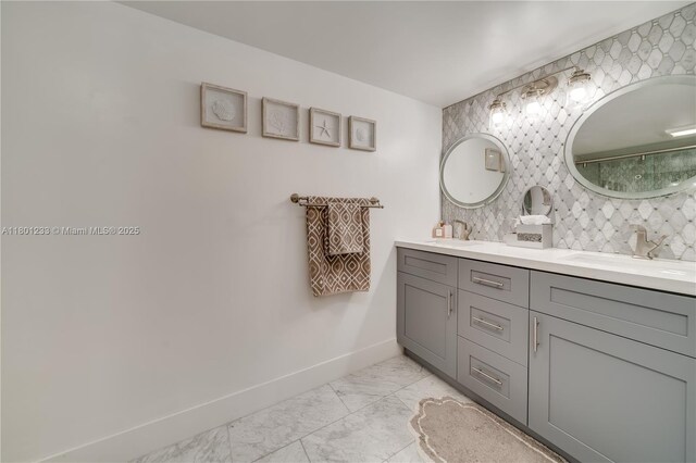 1201 S Ocean Dr Unit 1105N, Hollywood, FL 33019 - full bathroom with marble look tile flooring, baseboards, tasteful backsplash, and double vanity