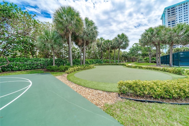 1201 S Ocean Dr Unit 1105N, Hollywood, FL 33019 - surrounding community featuring a putting area, fence, and view of wooded area