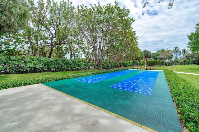 1201 S Ocean Dr Unit 1105N, Hollywood, FL 33019 - view of property's community with shuffleboard, a lawn, and view of wooded area