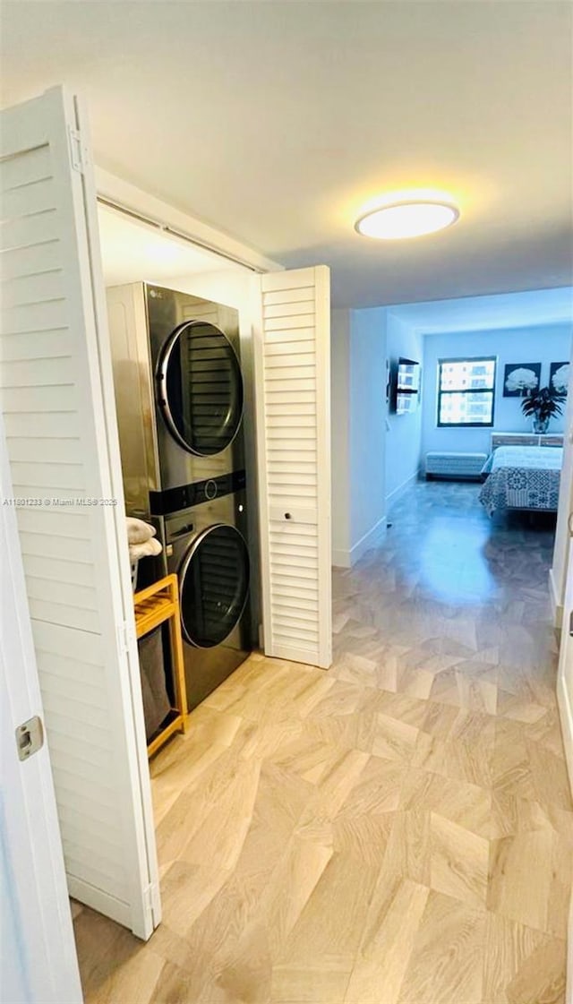 1201 S Ocean Dr Unit 1105N, Hollywood, FL 33019 - laundry area featuring estacked washer and dryer and baseboards