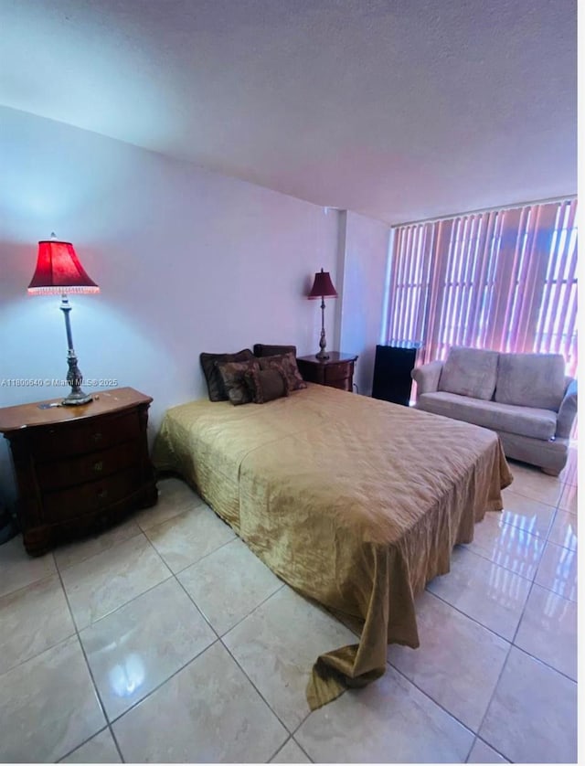 bedroom featuring light tile patterned flooring