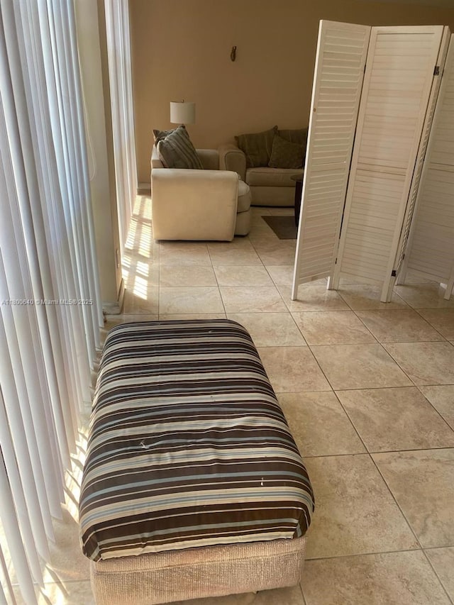 hallway featuring light tile patterned floors