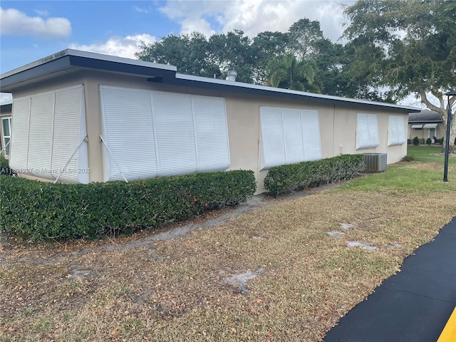 1022 Circle Dr Unit D, Delray Beach, FL 33445 - view of home's exterior featuring central AC