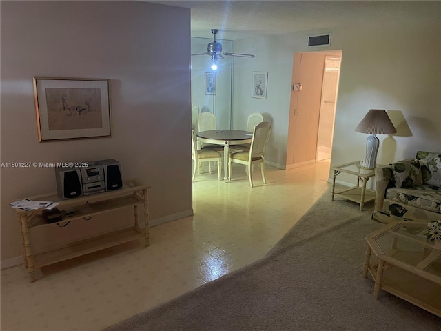1022 Circle Dr Unit D, Delray Beach, FL 33445 - living room featuring tile patterned floors, a ceiling fan, and baseboards
