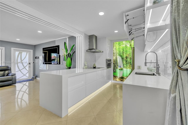 7011 Raleigh St, Hollywood, FL 33024 - kitchen featuring wall chimney exhaust hood, a sink, recessed lighting, black electric cooktop, and light tile patterned flooring