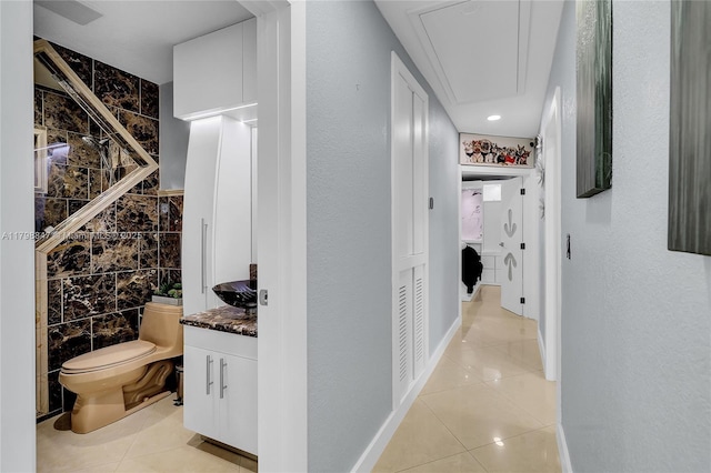 7011 Raleigh St, Hollywood, FL 33024 - hallway with attic access and light tile patterned floors