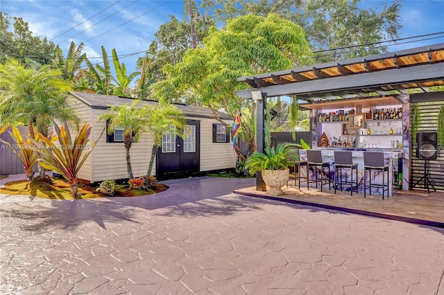 7011 Raleigh St, Hollywood, FL 33024 - view of patio / terrace featuring fence and an outdoor structure