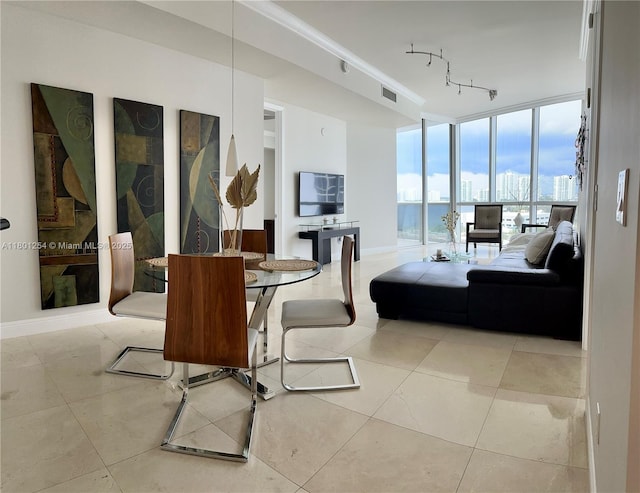 18101 Collins Ave Unit 1108, Sunny Isles Beach, FL 33160 - living room featuring floor to ceiling windows, tile patterned floors, and baseboards