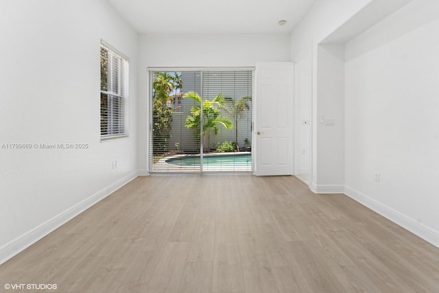 1576 Breakwater Ter, Hollywood, FL 33019 - unfurnished room featuring plenty of natural light and light wood-style floors