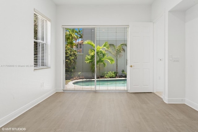 1576 Breakwater Ter, Hollywood, FL 33019 - spare room featuring wood finished floors and baseboards